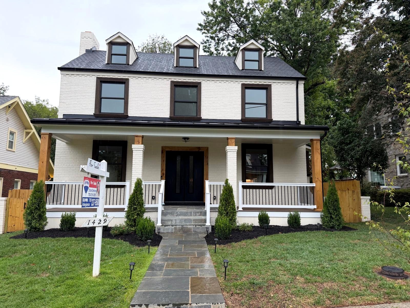 Completed exterior remodel with new porch, railings, walkway and landscaping in Virginia